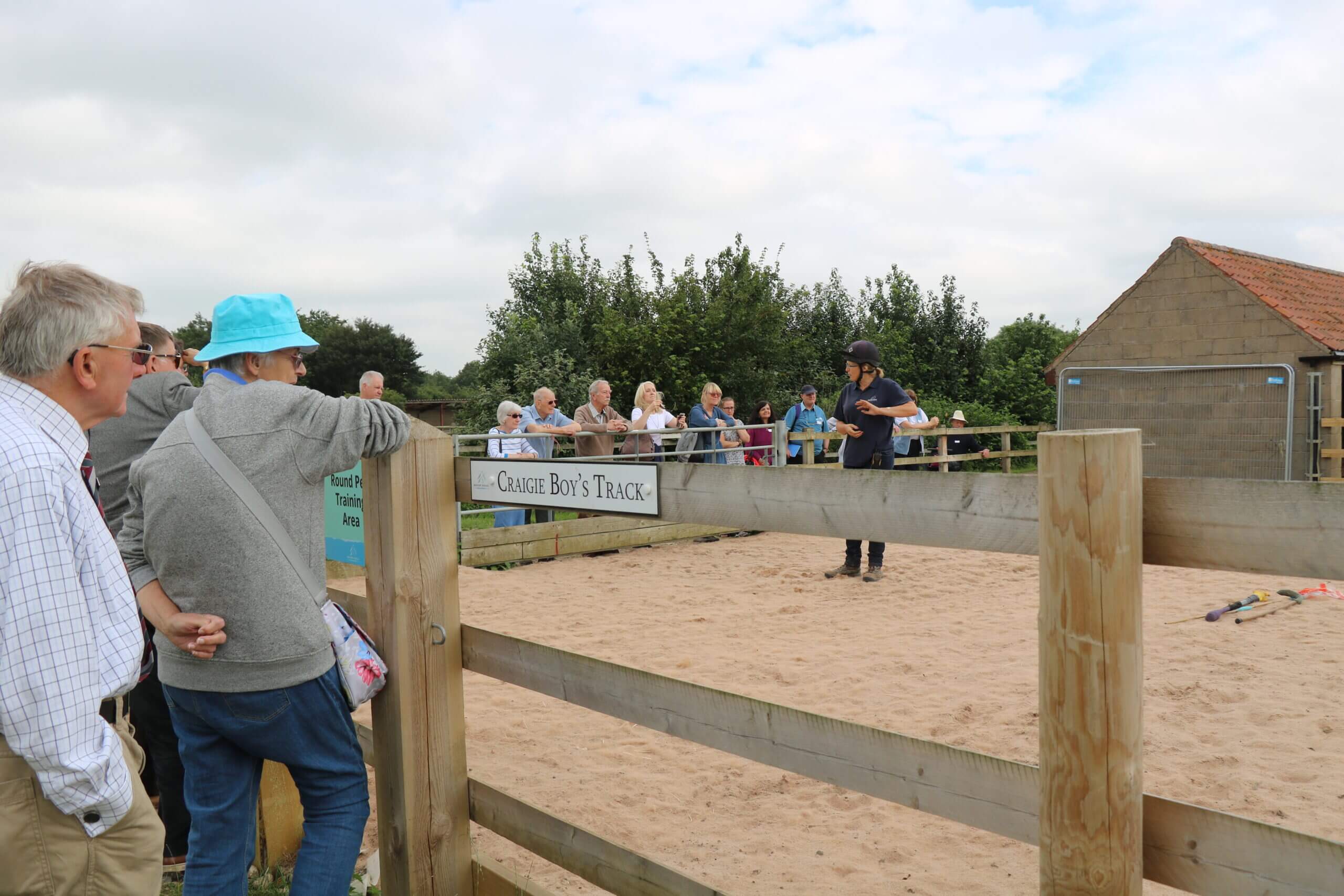 member of staff demonstrating equine training at a vip day