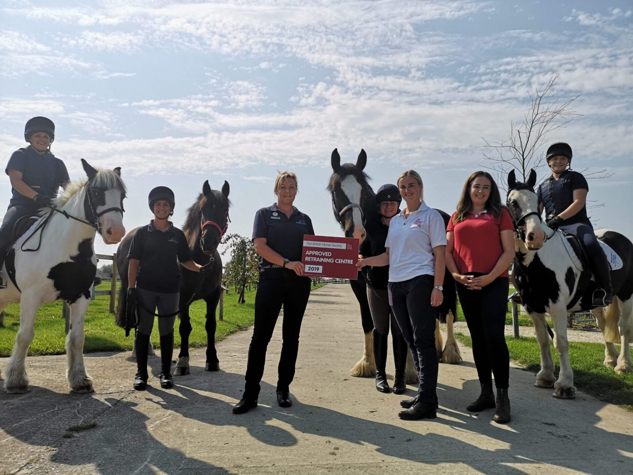 The Bransby Horses riding team accept BHS plaque for their Riding Barn