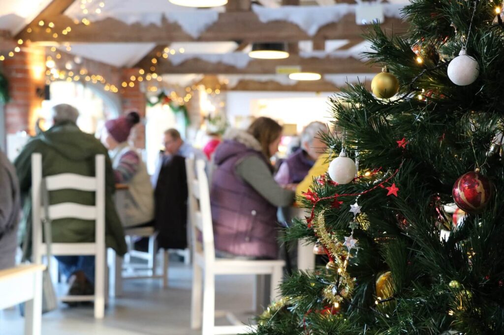 cafe decorated for christmas and full of people
