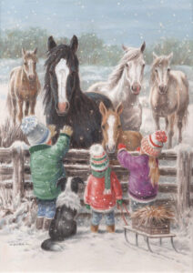 christmas card design of children stroking ponies stood by the fence in a snowy setting