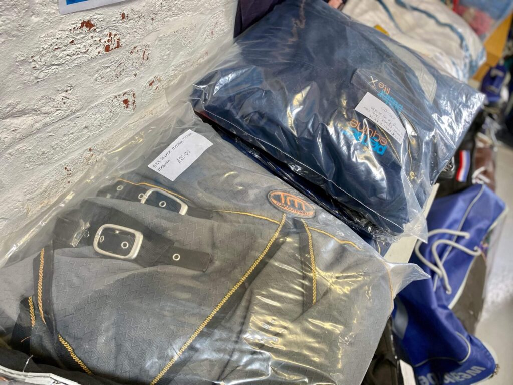 collection of donated rugs for sale