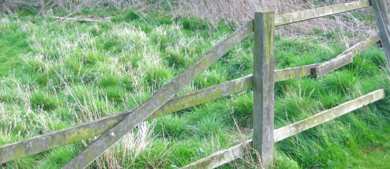 stock image of a broken fence