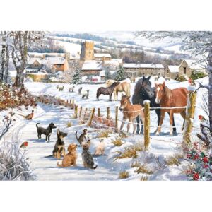 festive scene of various dogs sat on a snowy path looking at a field of horses, a fence separates them