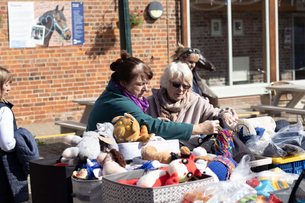 visitors browsing donated goods in the courtyard
